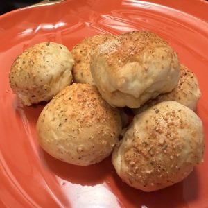 Golden pepperoni and mozzarella stuffed rolls made with frozen bread dough and topped with Parmesan and Italian seasoning.